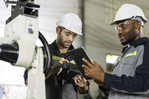 manufacturing crew working on machine