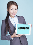 woman holding tablet with amazon logo