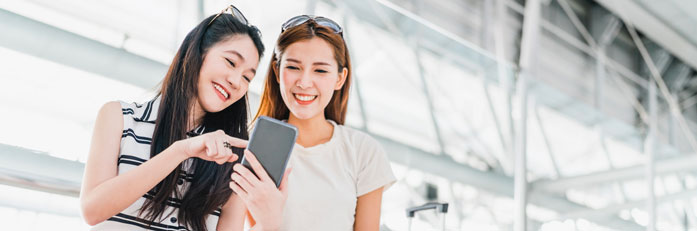 women looking at smart phone