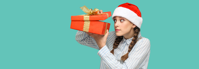 girl looking peeking into present