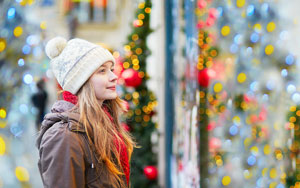 girl window shopping xmas