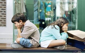 kids waiting in mall for shopping parent