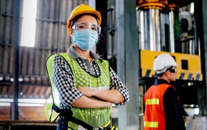 woman wearing a mask in a warehouse