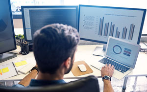 man analyzing data on a computer