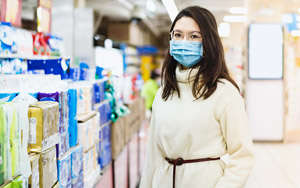 masked woman in a store