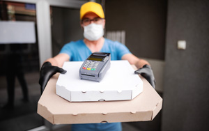 masked man delivering food