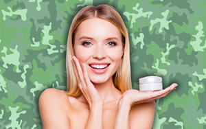 woman with lotion and camo background