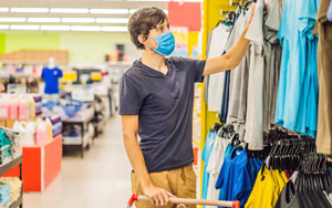 covid masked man shopping in a store