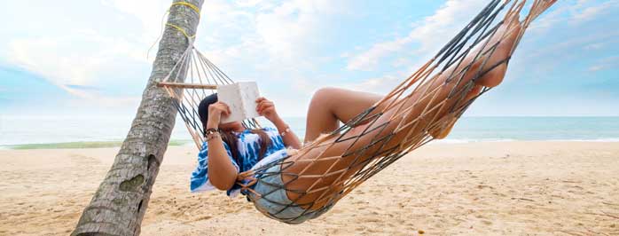 woman reading in a hammock