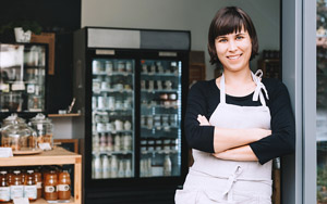 woman retailer in front of store