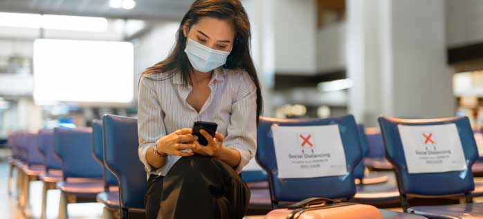 woman at airport covid-19