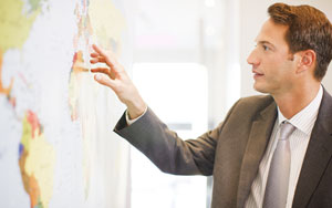 businessman examining map