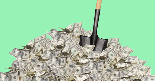 shovel in a pile of cash