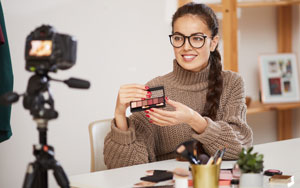 woman displaying product for online stream