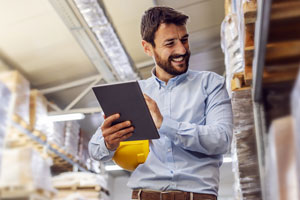 man taking inventory in the warehouse