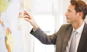 businessman examining map
