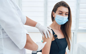 woman getting a vaccine shot