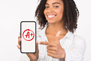 woman pointing at phone A+