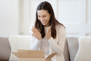 surprised woman opening a package