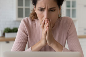 woman worried about online fraud